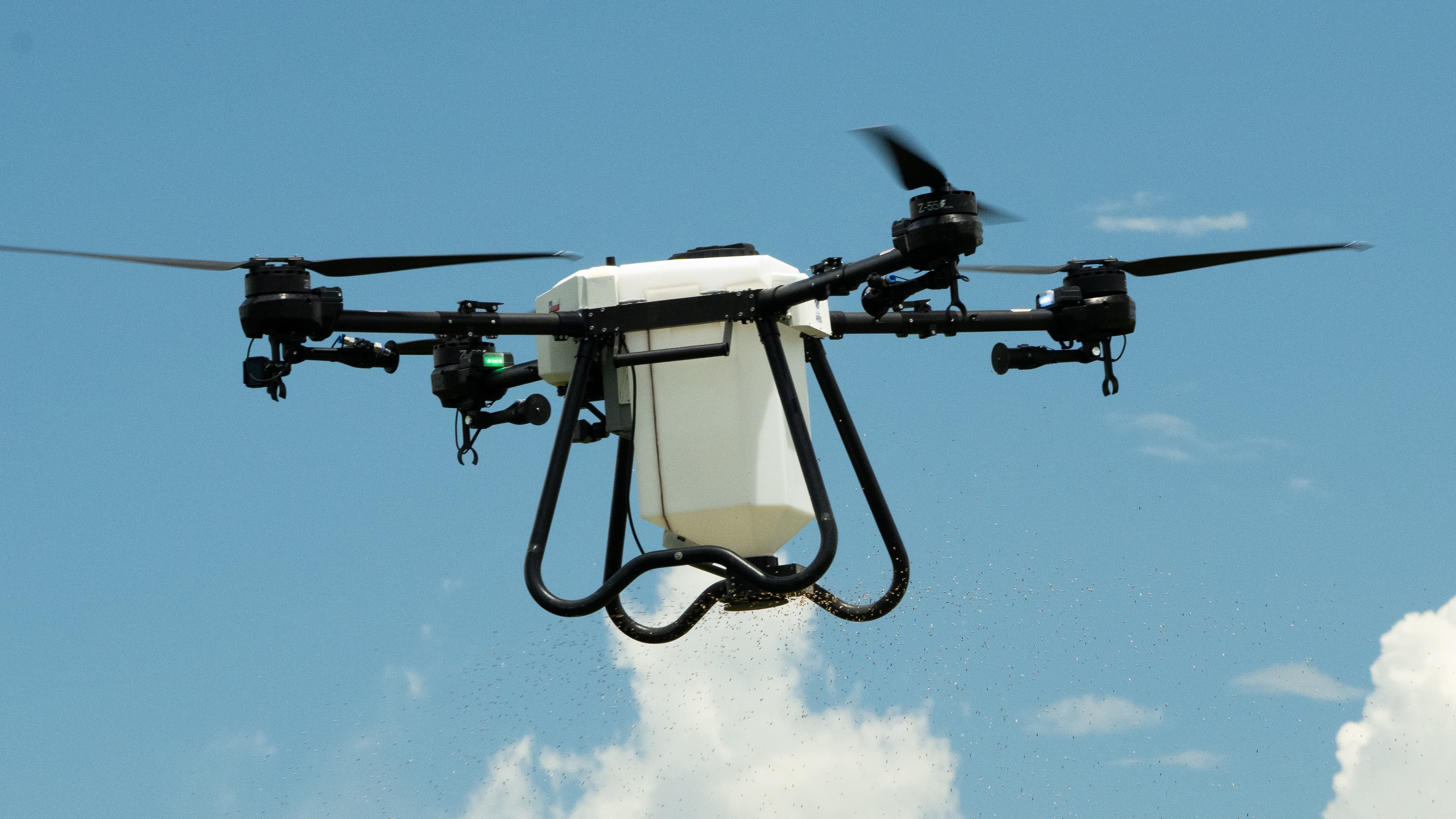 Hylio agricultural spray drone in flight